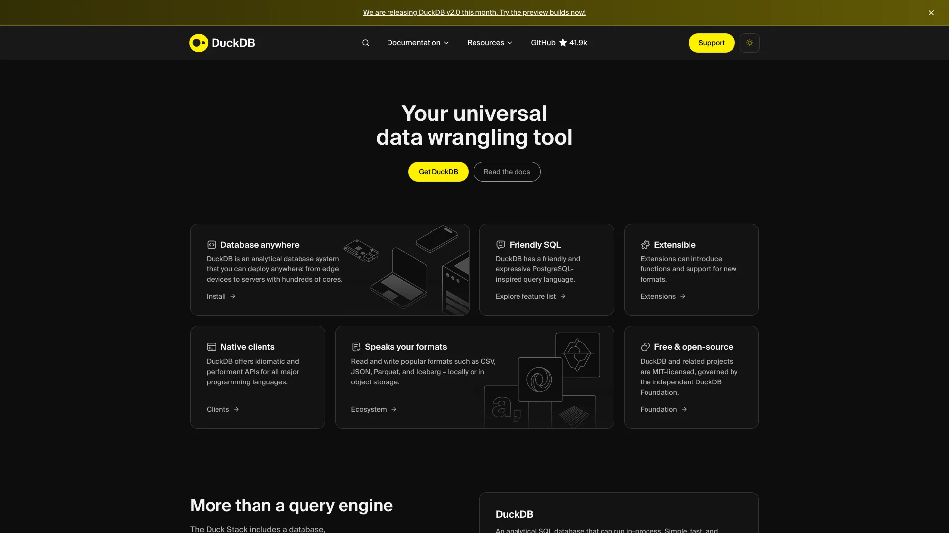 DuckDB homepage with the headline Your universal data wrangling tool, a Get DuckDB button, feature cards for formats and SQL, and a banner announcing DuckDB v2.0 preview builds
